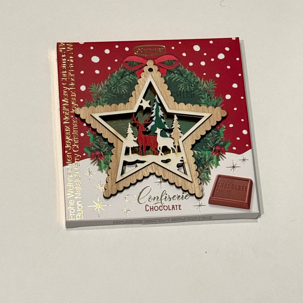 Gunthart Christmas Star Tree Ornament Designs with a Box of milk chocolates with Praline Cream