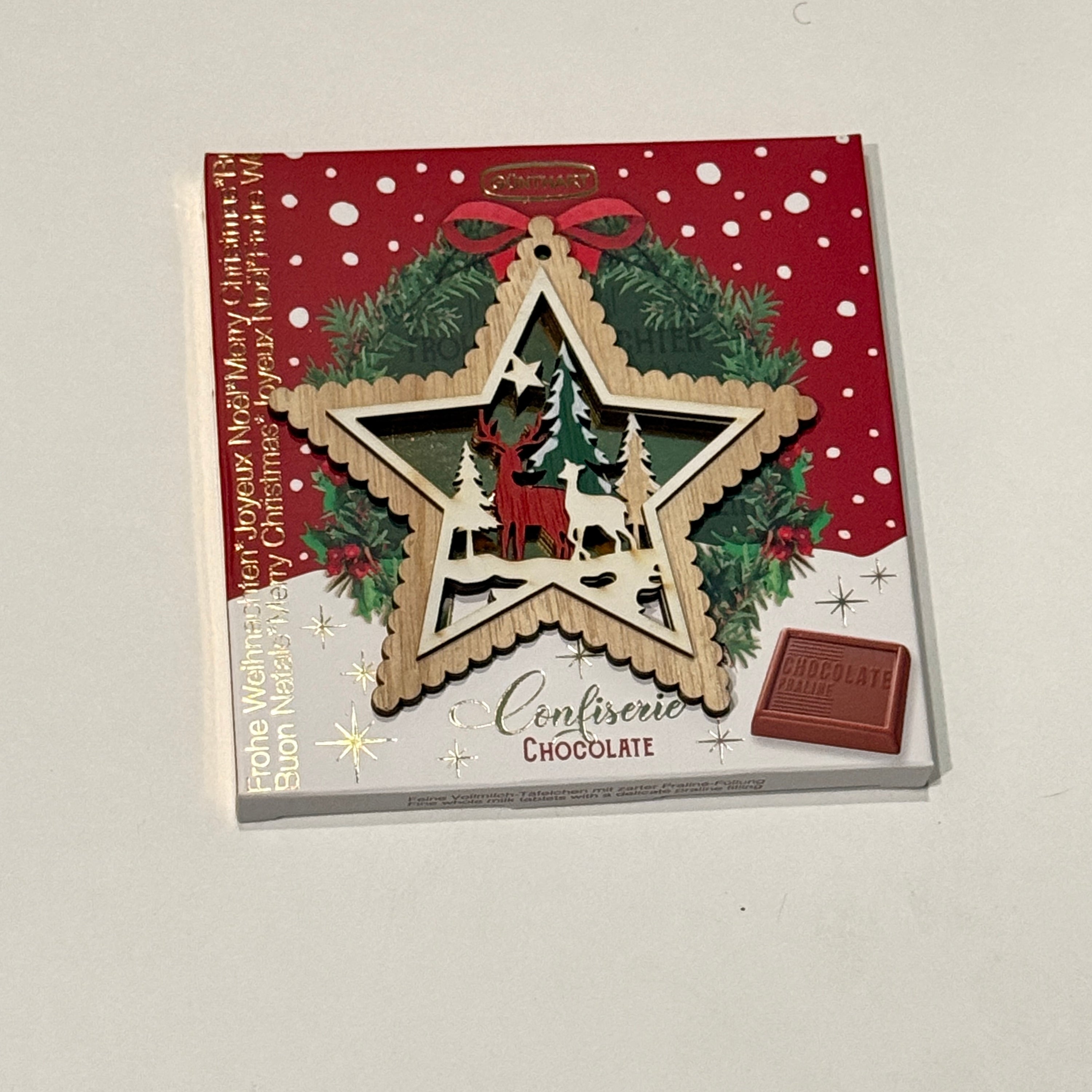 Gunthart Christmas Star Tree Ornament Designs with a Box of milk chocolates with Praline Cream